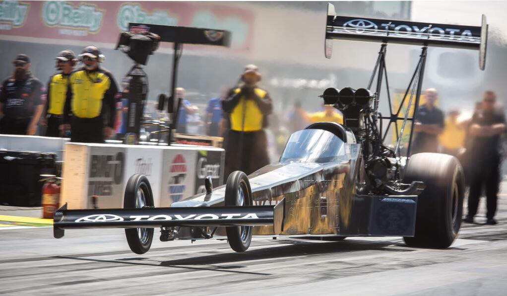 Shawn Langdon explodes off the starting line during the Top Fuel Dragster races during the NHRA Sonoma Nationals at Sonoma Raceway, south of Petaluma Calif. Sunday, August 2, 2015.