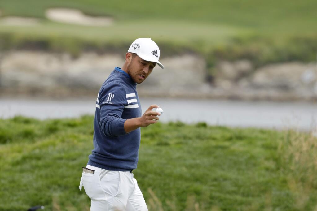 Xander Schauffele waves after his putt on the 17th hole during the first round of the U.S. Open Championship golf tournament Thursday, June 13, 2019, in Pebble Beach, Calif. (AP Photo/Matt York)