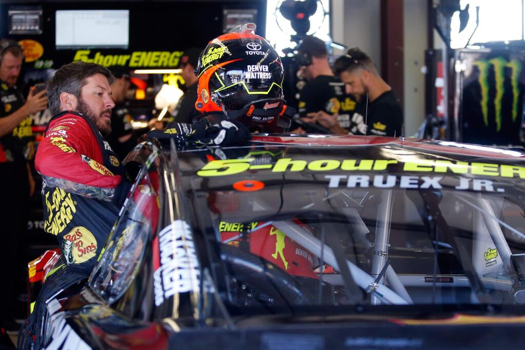 Martin Truex Jr., driver of the 5-hour Energy Toyota Camry, gets into his car for a practice session for the NASCAR Monster Energy Cup Series Toyota/Save Mart 350 race at Sonoma Raceway on Friday, June 22, 2018. (Alvin Jornada / The Press Democrat)