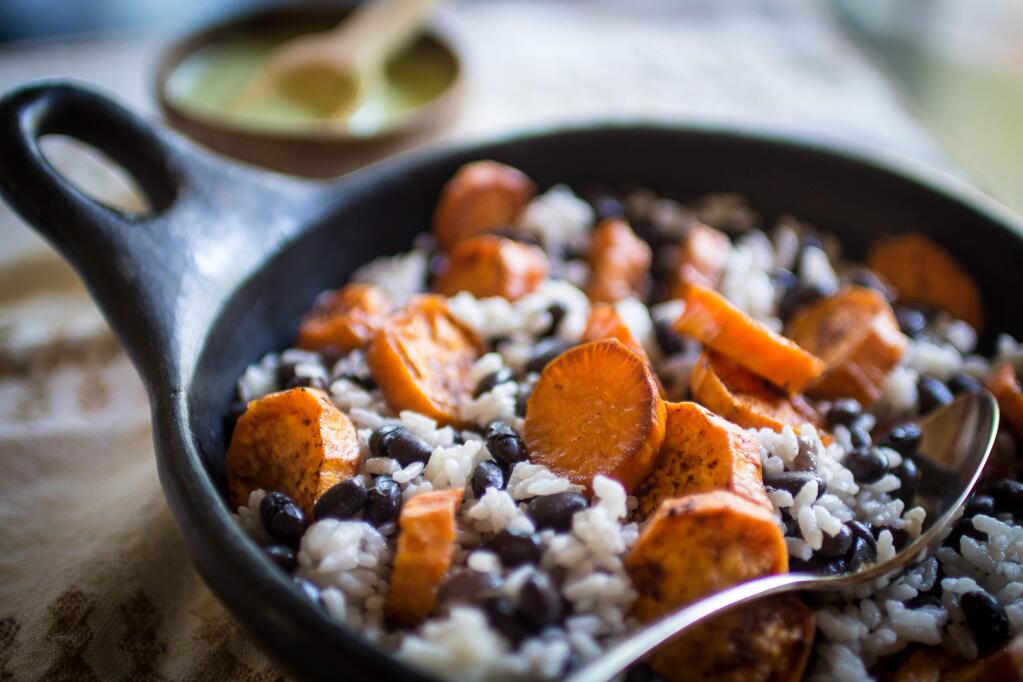 A green sauce adds herbaceous flavor to Black Beans and Rice with Sweet Potato. (Steve Sando/Rancho Gordo)