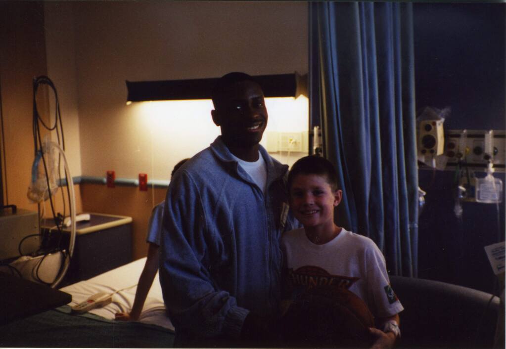 On Jan. 19, almost 17 years to the day from their first meeting (seen above), Earl Boykins walked back into Bobby Sharp's life when Sharp visited a friend in Arkansas, where Boykins is a Razorbacks assistant coach. Sharp made sure he didn't miss his chance to tell Boykins what the former NBA player's visit 17 years ago meant to him. (Sharp family)