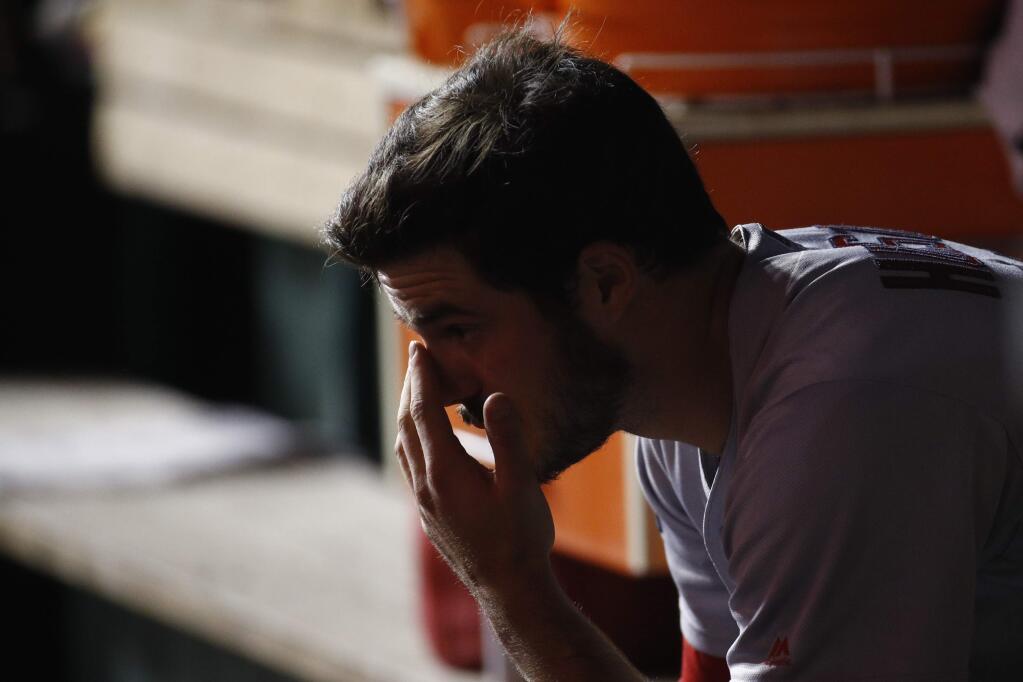 St. Louis Cardinals starting pitcher Dakota Hudson sits on the bench after being relieved during the first inning of Game 4 of the baseball National League Championship Series against the Washington Nationals Tuesday, Oct. 15, 2019, in Washington. (AP Photo/Patrick Semansky)