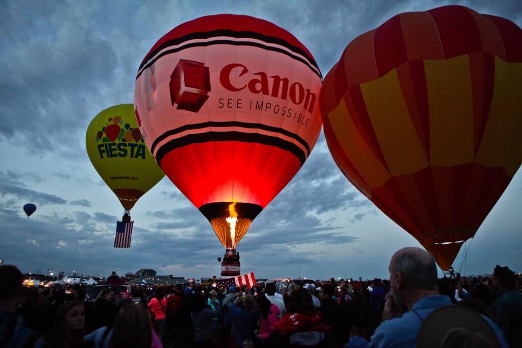 The Canon U.S.A., Inc., hot air balloon takes off on Saturday, Oct. 3, 2015, during the first mass ascension of the 44th Annual Albuquerque International Balloon Fiesta. (Mark Holm/AP Images for Canon U.S.A., Inc.)