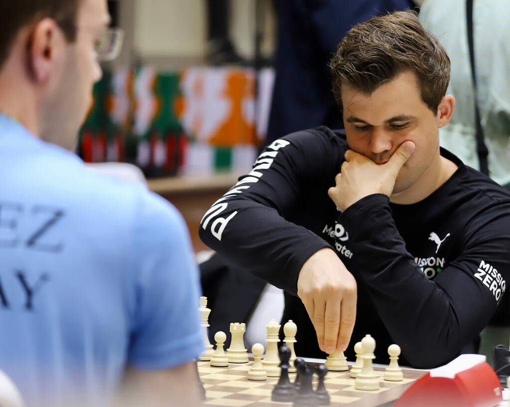 Norway's World Chess Champion Magnus Carlsen competes in the 44th Chess Olympiad in Mamallapuram, India, Saturday, July 30, 2022.  (AP Photo)