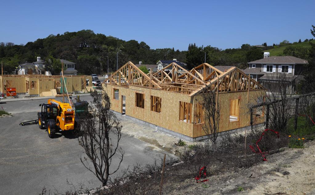 Homes are under construction along Sonterra Court, at Bella Vista Way, in the Fountoungrave area of Santa Rosa on Monday, April 23, 2018. (Christopher Chung/ The Press Democrat)