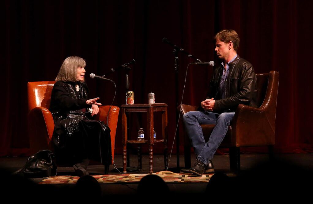 Christopher Rice, right, jokes with his mother Anne Rice during a talk and book signing hosted by Copperfield's Books held at Santa Rosa High School, Tuesday, Nov. 11, 2014. (CRISTA JEREMIASON/ PD)