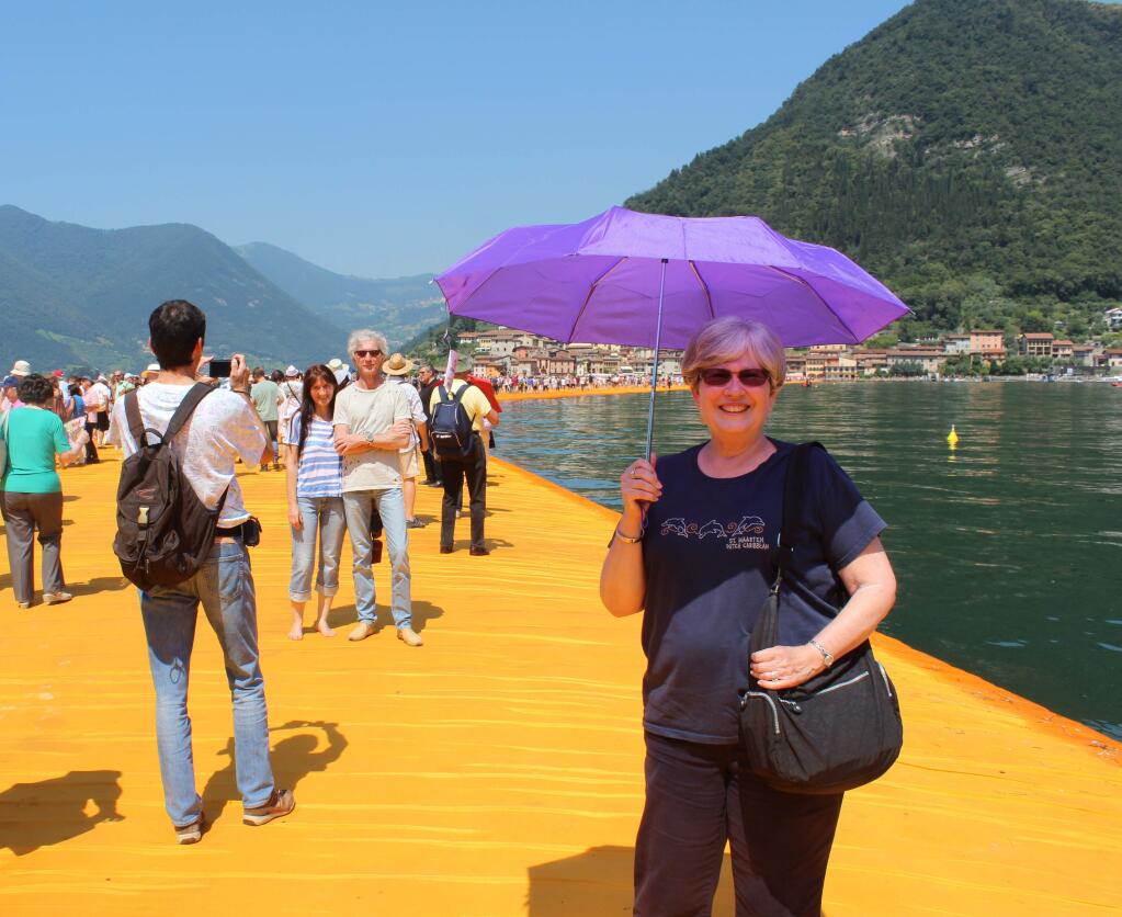 Dee Webb of Santa Rosa stands on artist Christo's floating pier in Italy. (Allan and Dee Webb)
