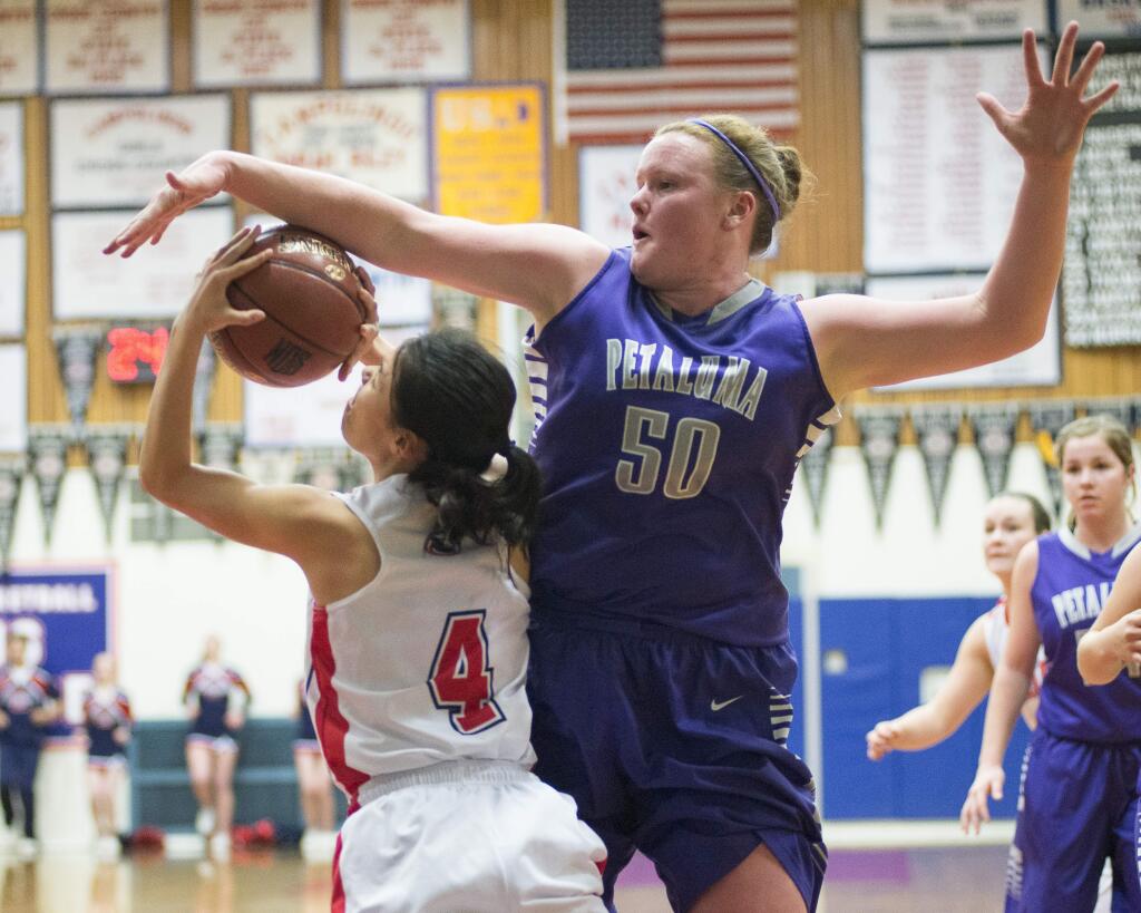 RICH LANGDON/FOR THE ARGUS-COURIERPetaluma's Allison Scranton blocks a Campolindo shot. Pealuma faltered in the late going and lost a NCS playoff game at Campolindo, 53-37.