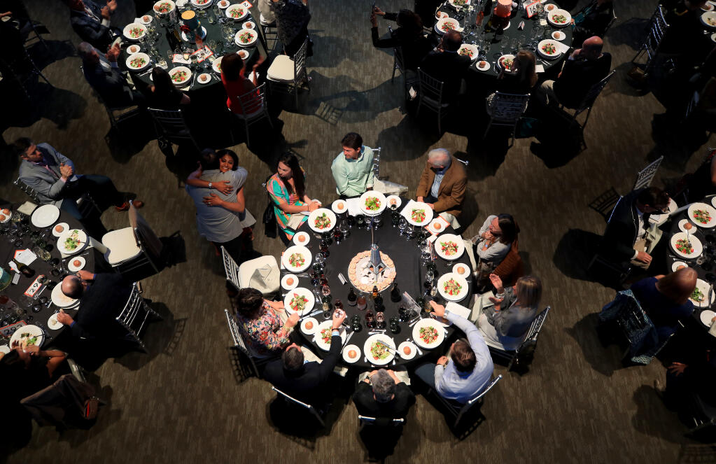 At the Luther Burbank Center for the Arts in Santa Rosa, those attending the Art of Dessert, gather for dinner and auction, Saturday, April 9, 2022. (Kent Porter / The Press Democrat) 2022