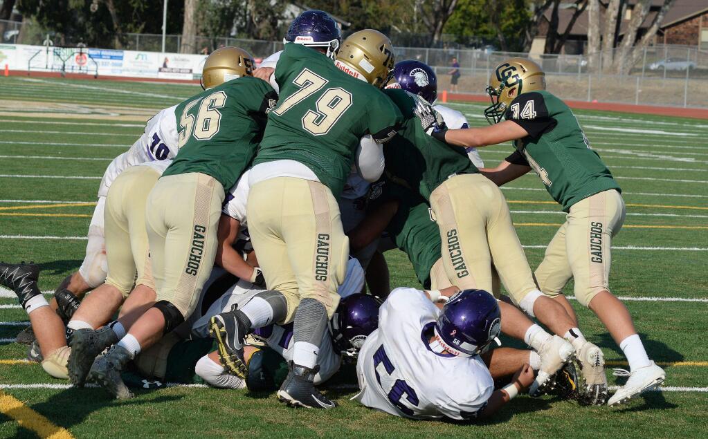 SUMNER FOWLER/FOR THE ARGUS-COURIERAmong the changes for Casa Grande football this season was the return of the Egg Bowl and a chance for the Gauchos to use their muscle against Petaluma. The Trojans prevailed at the end of a good game, 20-14.