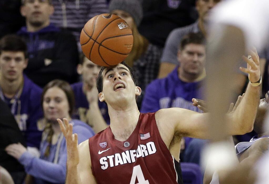 Stanford's Stefan Nastic eyes a loose ball during the first half against Washington in a game Wednesday, Jan. 28, 2015, in Seattle. (AP Photo/Elaine Thompson)