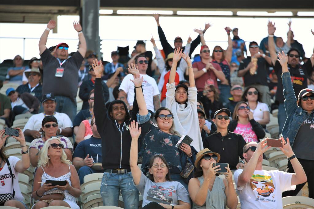 Cheering fans in the grandstands prior to last year's IndyCar season finale at Sonoma Raceway, Sept. 17, 2017. This year's Verizon IndyCar Series finale will be held Sept. 14-16. (photos Will Bucquoy for the Press Democrat).