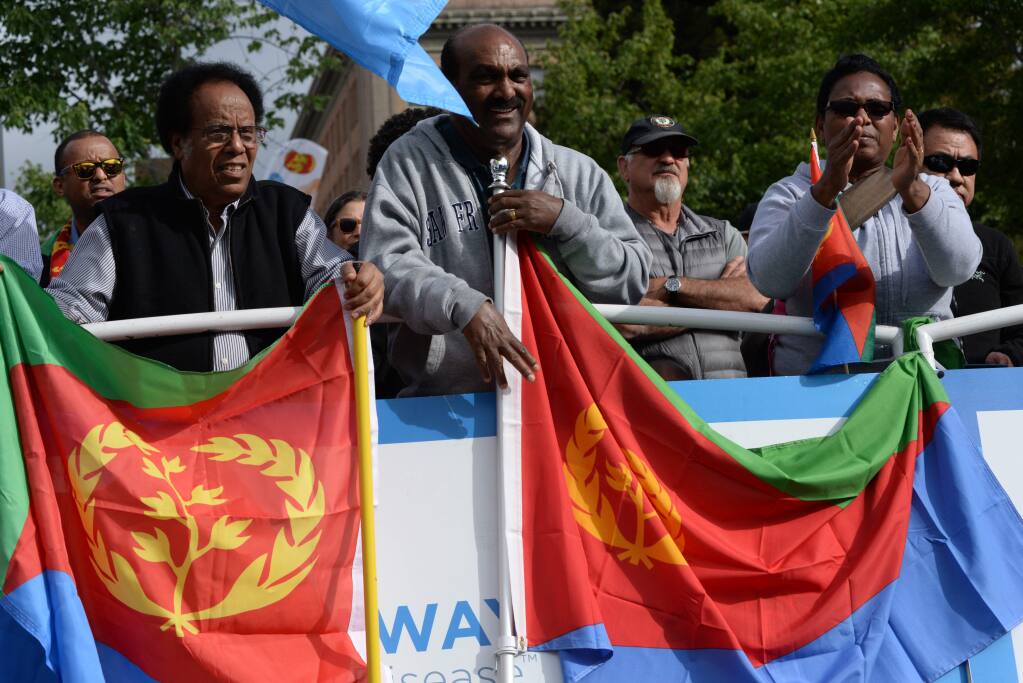 Eritrean fans awaiting the start of the Womens race before the start of the AMGEN Tour of California in downtown Santa Rosa, Calfiornia, Saturday, May 21, 2016. (ERIK CASTRO / The Press Democrat)