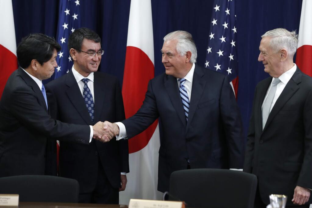 Japanese Defense Minister Itsunori Onodera, left, next to Japanese Foreign Minister Taro Kono, shakes hands with Secretary of State Rex Tillerson, next to Defense Secretary James Mattis, at the start of a Security Consultative Committee meeting, Thursday, Aug. 17, 2017, at the State Department in Washington. (AP Photo/Jacquelyn Martin)