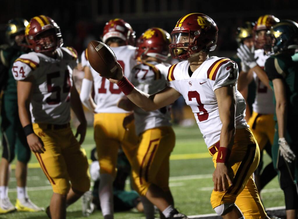Cardinal Newman's quarterback Jackson Pavitt (3) celebrates after he scored a touchdown against Maria Carrillo in the first half of a makeup football game at Maria Carrillo High School, in Santa Rosa, Calif., on Monday, November 4, 2019. (Photo by Darryl Bush / For The Press Democrat)