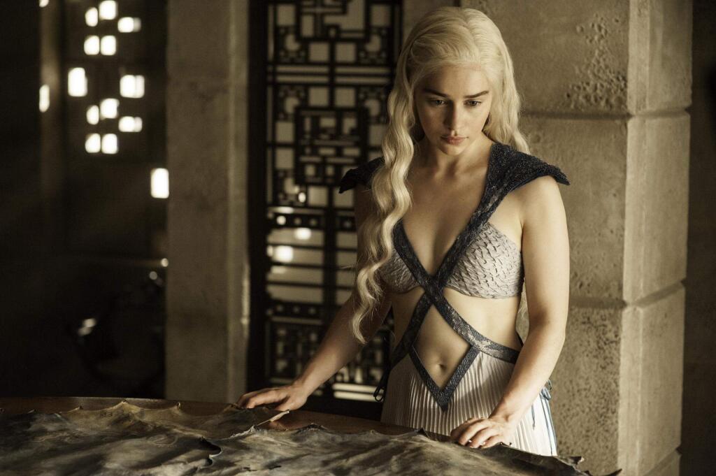 In this image released by HBO, Daenerys Targaryen, portrayed by Emilia Clarke, appears in a scene from season four of 'Game of Thrones.' The season five premiere airs on Sunday. (AP Photo/HBO, Helen Sloan)
