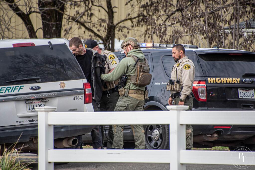 Mendocino County law enforcement authorities take Christopher Ryan Brockway, 33, into custody after a three-hour standoff Sunday in Laytonville. (Brandon Tripp Photography) Jan. 16, 2022.
