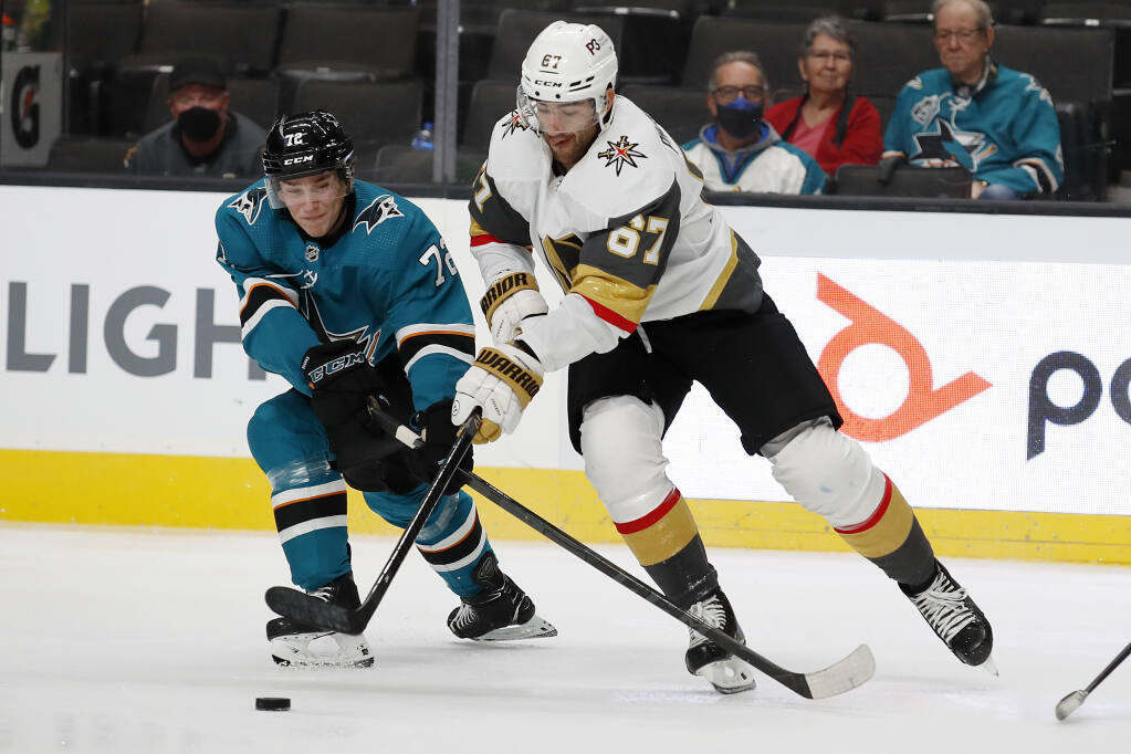 San Jose Sharks William Eklund (72) battles for the puck against Vegas Golden Knights left wing Max Pacioretty (67) in the second period of a preseason NHL hockey game in San Jose, Calif., Saturday, Oct. 9, 2021. (AP Photo/Josie Lepe)