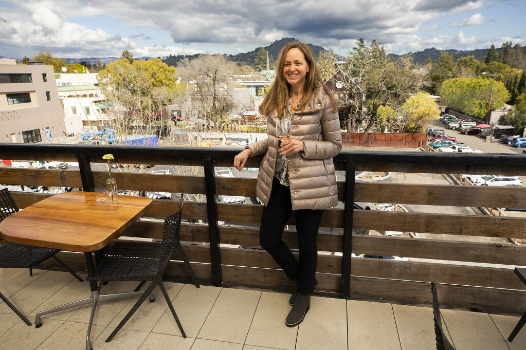 Circe Sher president of Piazza Hospitality, in the rooftop bar of the Harmon Guest House in Healdsburg, on Friday, March 19. The group also owns the Hotel Healdsburg, H2 Hotel, and the soon-to-be-built Hotel Sebastopol in Sebastopol.   (Photo by John Burgess/The Press Democrat)
