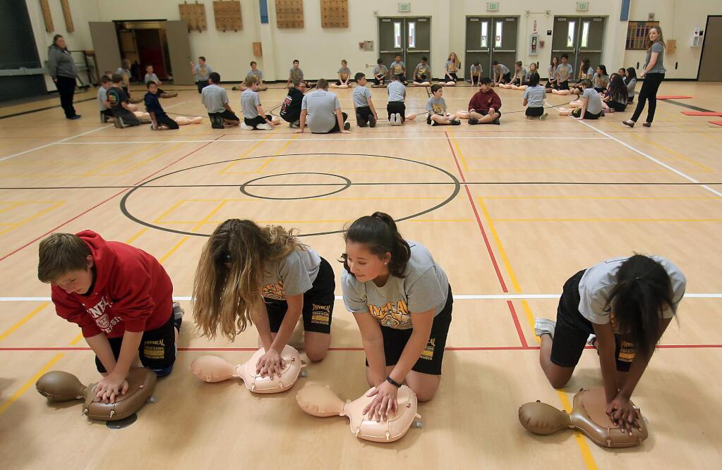 Kent Porter/The Press DemocratKenilworth Jr. High School students take part in CPR instruction that was hosted by the Petaluma Fire Department in March 2017 at Kenilworth Jr. High in Petaluma.