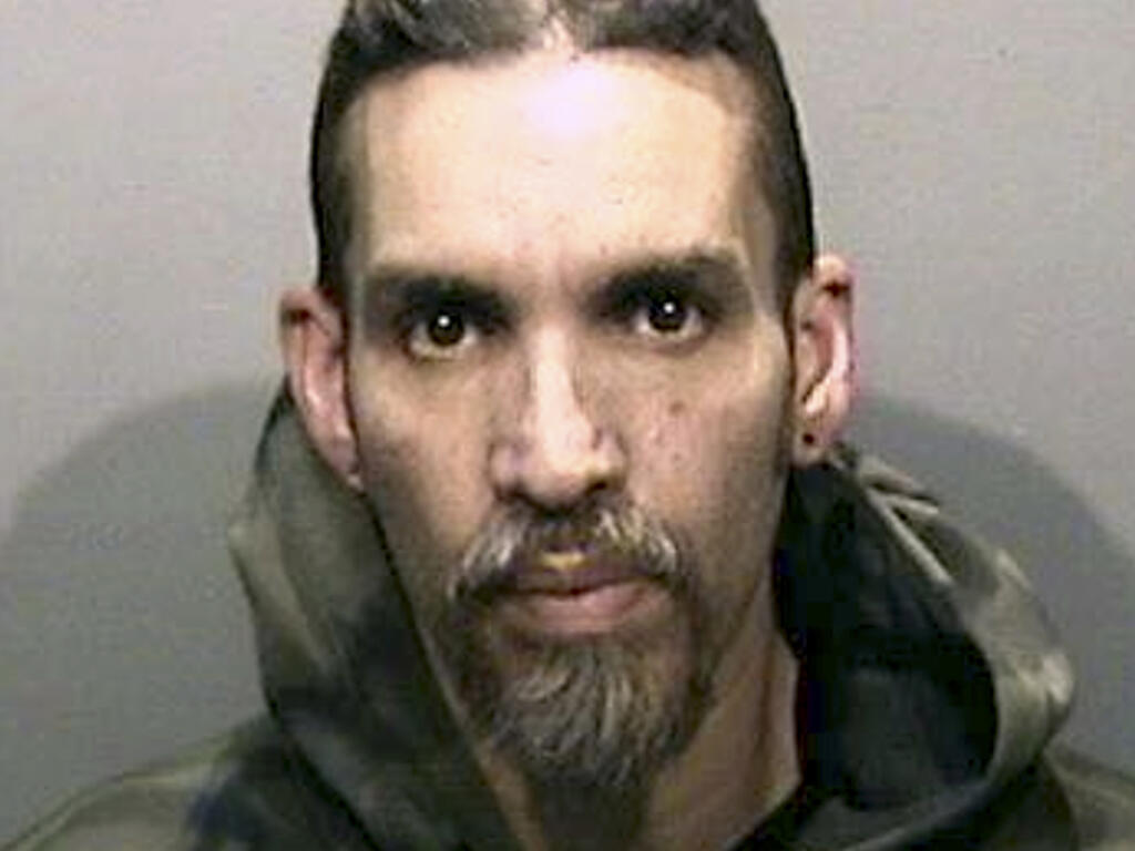FILE - This June 5, 2017, file photo released by the Alameda County Sheriff's Office shows Derick Almena at Santa Rita Jail in Alameda County, Calif.  (Alameda County Sheriff's Office via AP, File)