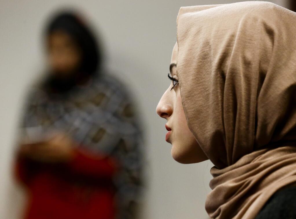 Bayan Zehlif, 17, speaks during a news conference on Monday, May 9, 2016 in Anaheim, Calif. Zehlif posted a photo on Facebook of what she says is her picture with the name 'Isis Phillips' underneath it in the Los Osos High School yearbook. She writes in the post that she's 'extremely saddened, disgusted, hurt and embarrassed.' She says the school reached out and told her it was a 'typo,' but she adds 'I beg to differ.' (AP Photo/Chris Carlson)