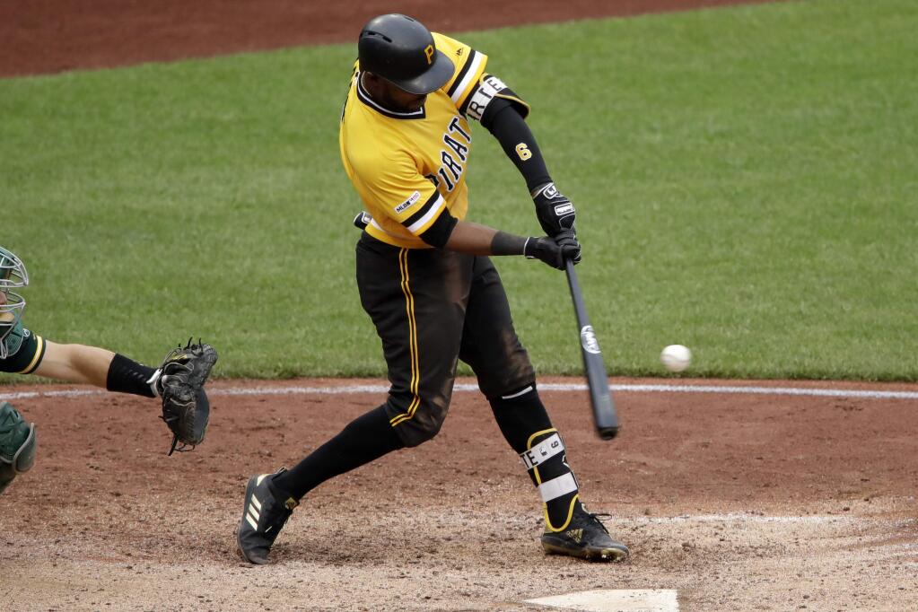 Pittsburgh Pirates' Starling Marte hits a three-run walk-off home run off Oakland Athletics relief pitcher Fernando Rodney in the 13th inning of a baseball game in Pittsburgh, Sunday, May 5, 2019. The Pirates won 5-3. (AP Photo/Gene J. Puskar)