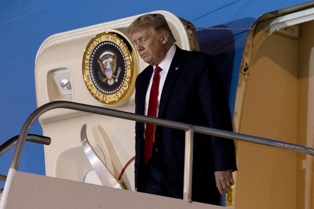 President Donald Trump arrives at McCarran International Airport in Las Vegas, Saturday, Sept. 12, 2020, after speaking at a rally in Minden, Nev. (AP Photo/Andrew Harnik)