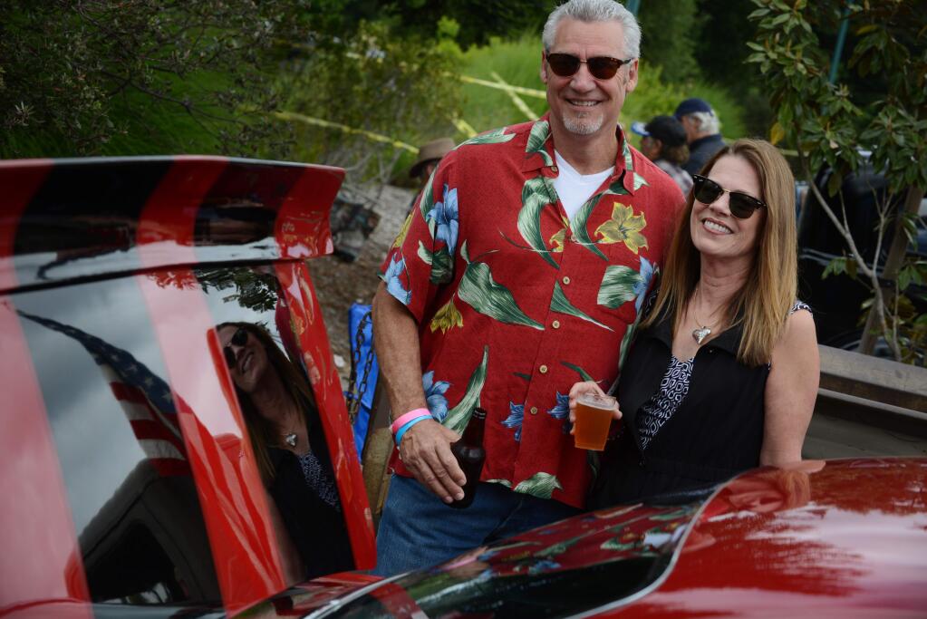 Gary Crosby, left, and Kim Romero during the 6th annual Driven to Perfection Classic Car Show and Cruise held Saturday at O'Reilly Media in Sebastopol, California. The event benefits the Sebastopol Area Senior Center. May 26, 2018(Photo: Erik Castro/for The Press Democrat)
