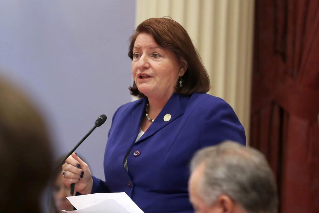 FILE - In this Sept. 12, 2019, file photo, California state Senate President Pro Tem Toni Atkins of San Diego speaks on the floor of the Senate in Sacramento, Calif. The California Senate's plan to cover a projected budget deficit rejects Gov. Gavin Newsom's proposed cuts to public education and health care programs. Newsom's plan would cut funding for public schools by about $8 billion. The Senate's plan would restore $2.7 billion of those cuts, the rest being deferred to future years. (AP Photo/Rich Pedroncelli, File)