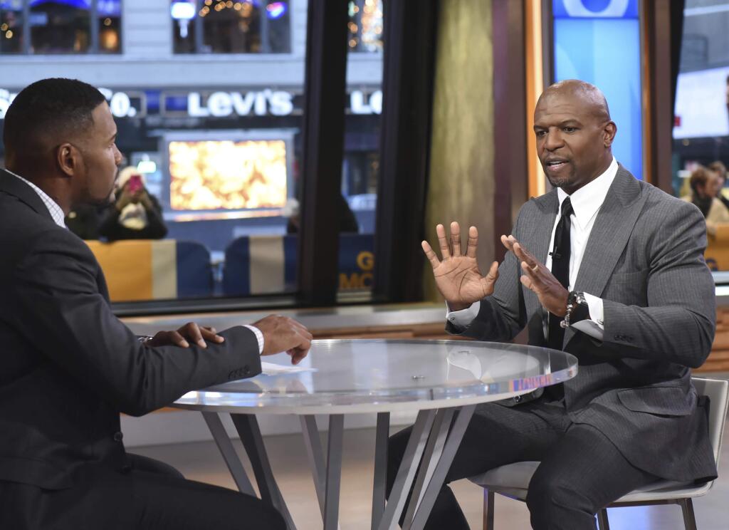 This image released by ABC shows actor Terry Crews, right with co-host Michael Strahan during a segment on 'Good Morning America,' Wednesday, Nov. 15, 2017, in New York. Crews told Strahan that he ‚Äúnever felt more emasculated‚Äù than when a powerful Hollywood agent groped him at a party last year. Crews confirmed that he recently filed a police report against a top agent at William Morris Endeavor. The star of TV‚Äôs ‚ÄúBrooklyn Nine-Nine‚Äù says he felt empowered to share his experience after so many women came forward with allegations against Weinstein. (Paula Lobo/ABC via AP)