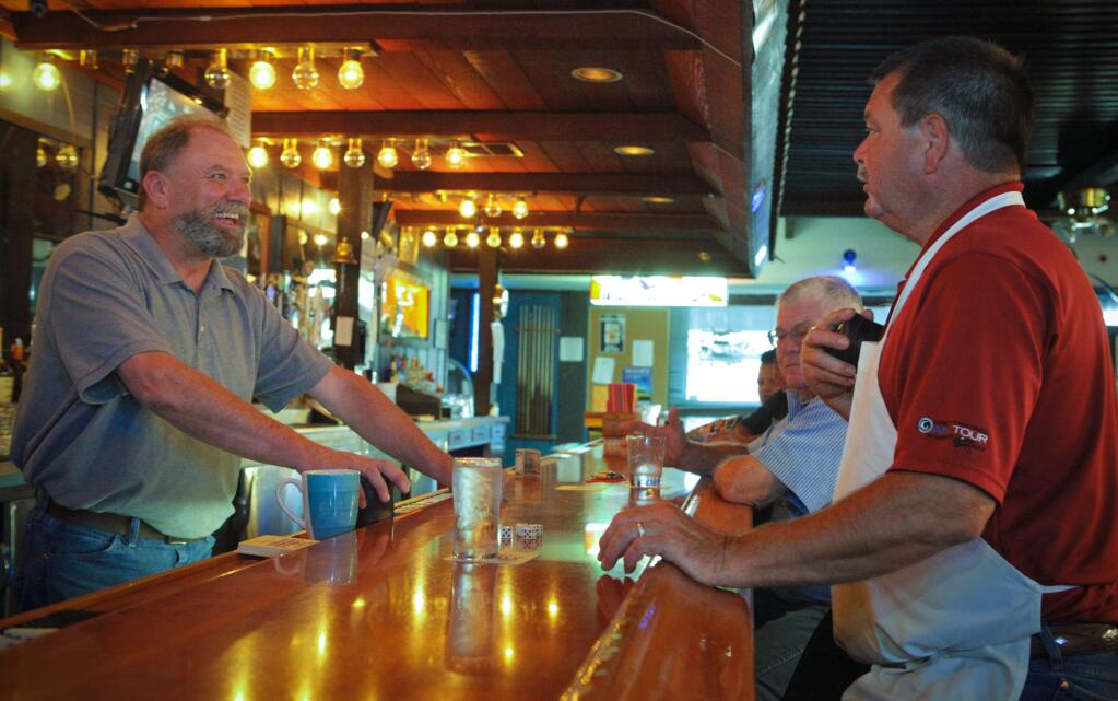 Petaluma, CA, USA. Tuesday, July 10, 2017._ Steve Figone, a bartender, talks with Aquarium's owner Dennis Scarpete . (CRISSY PASCUAL/ARGUS-COURIER STAFF)
