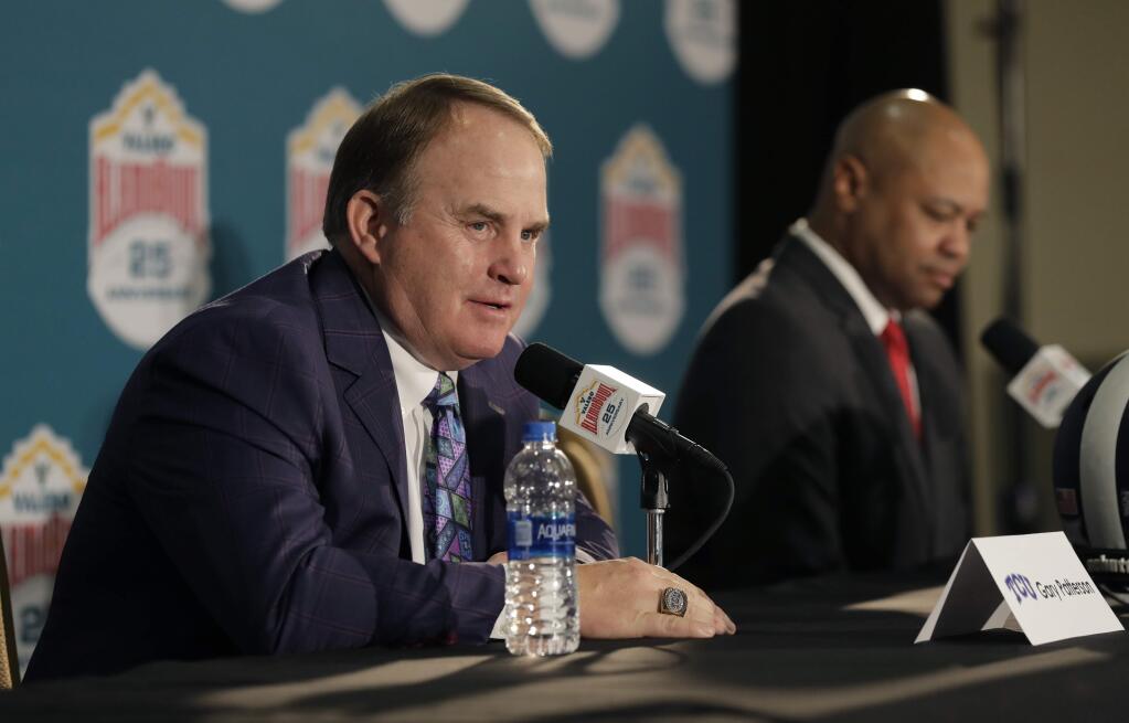 TCU head coach Gary Patterson, left, and Stanford head coach David Shaw, right, take part in a news conference for the Alamo Bowl Wednesday, Dec. 27, 2017, in San Antonio. The game is scheduled for Thursday, Dec. 28. (AP Photo/Eric Gay)