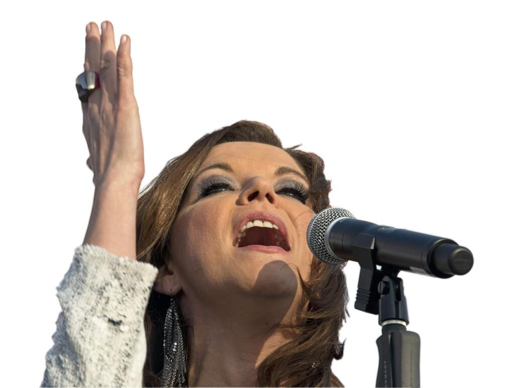 In this photo provided by Carnival Cruise Line, country music artist Martina McBride performs aboard the Carnival Freedom Saturday, Feb. 14, 2015, while the ship was docked in Galveston, Texas. (AP Photo/Carnival Cruise Line, Andy Newman)