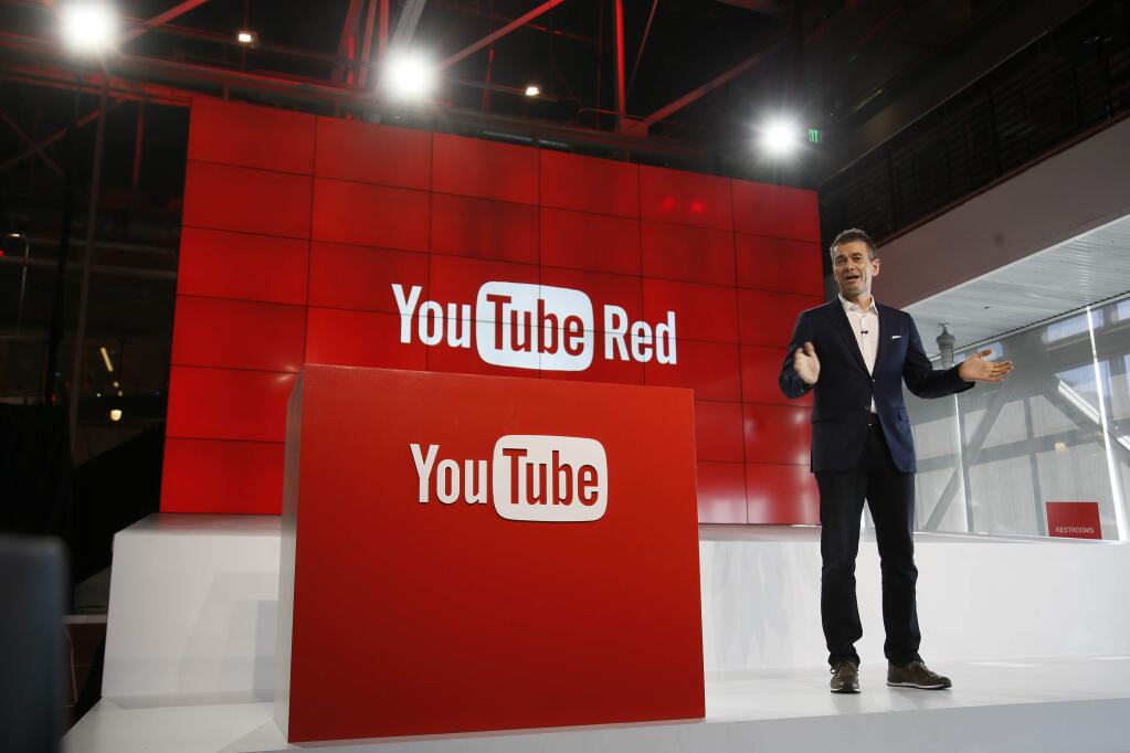 FILE - In this Oct. 21, 2015, file photo, Robert Kyncl, YouTube Chief Business Officer, speaks as YouTube unveils 'YouTube Red,' a new subscription service, at YouTube Space LA offices in Los Angeles. YouTube explained why some gay-themed content was restricted for certain users in a tweet on March 19, 2017. (AP Photo/Danny Moloshok, File)