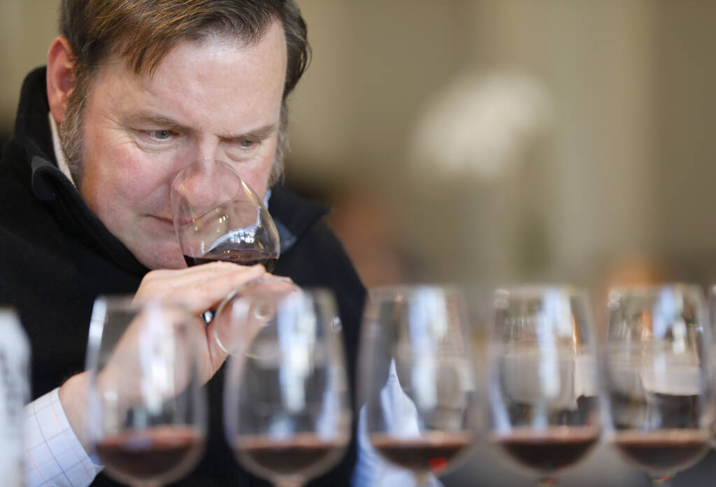 Chris Sawyer, sommelier at Gravenstein Grill, tastes a pinot noir during the first day of judging at the 11th annual North Coast Wine Challenge at the Sonoma County Fairgrounds in Santa Rosa. The two-day contest kicked off Tuesday, April 4, 2023. (Beth Schlanker / The Press Democrat)