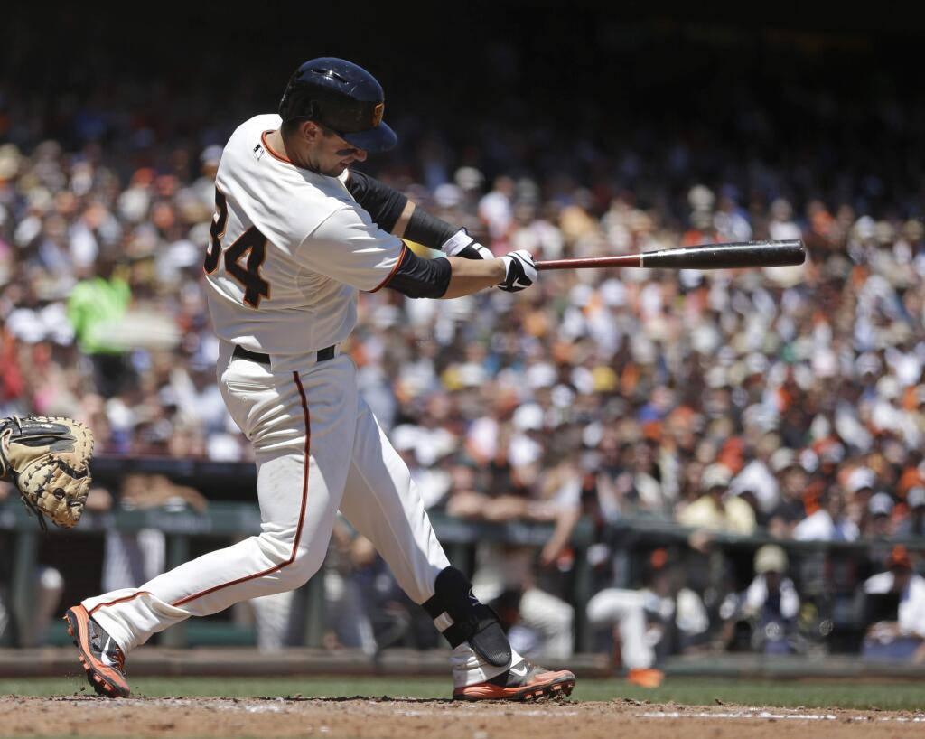 San Francisco Giants' Andrew Susac swings for an RBI single off Pittsburgh Pirates' Charlie Morton in the third inning of a baseball game Wednesday, July 30, 2014, in San Francisco. (AP Photo/Ben Margot)