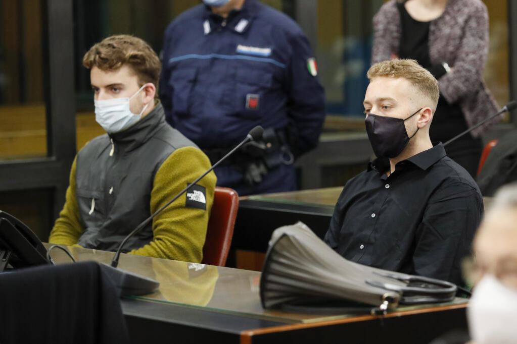 This April 26, 2021 file photo shows, Gabriel Natale-Hjorth, left, and his co-defendant Finnegan Lee Elder, both from the United States, at the start of a hearing in the first trial in Rome over the multiple stabbing death of a Carabinieri police officer while they were on vacation in Rome in 2019. An Italian appeals court on Thursday, March 17, 2022, reduced their sentences from life term to 24 years to Finnegan Lee Elder and to 22 years to Gabriel Natale-Hjorth. (Remo Casilli/Pool Photo via AP, FILE)