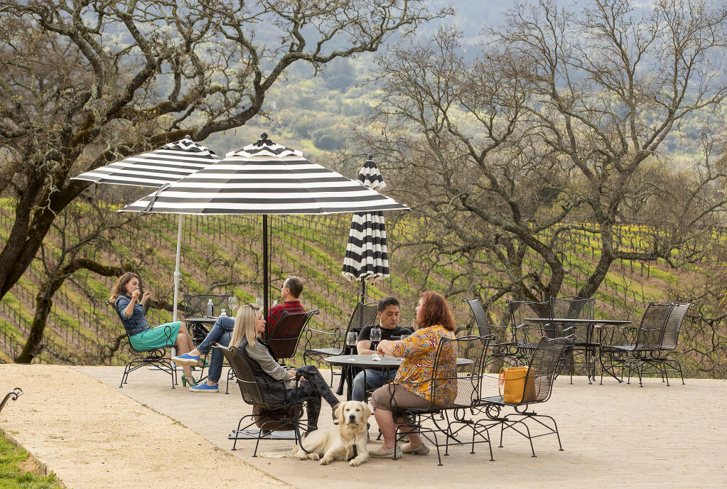 Guests sipping wine and social distancing on the B.R. Cohn patio in the Sonoma Valley on Friday, March 5, 2021. (Photo by John Burgess/The Press Democrat)