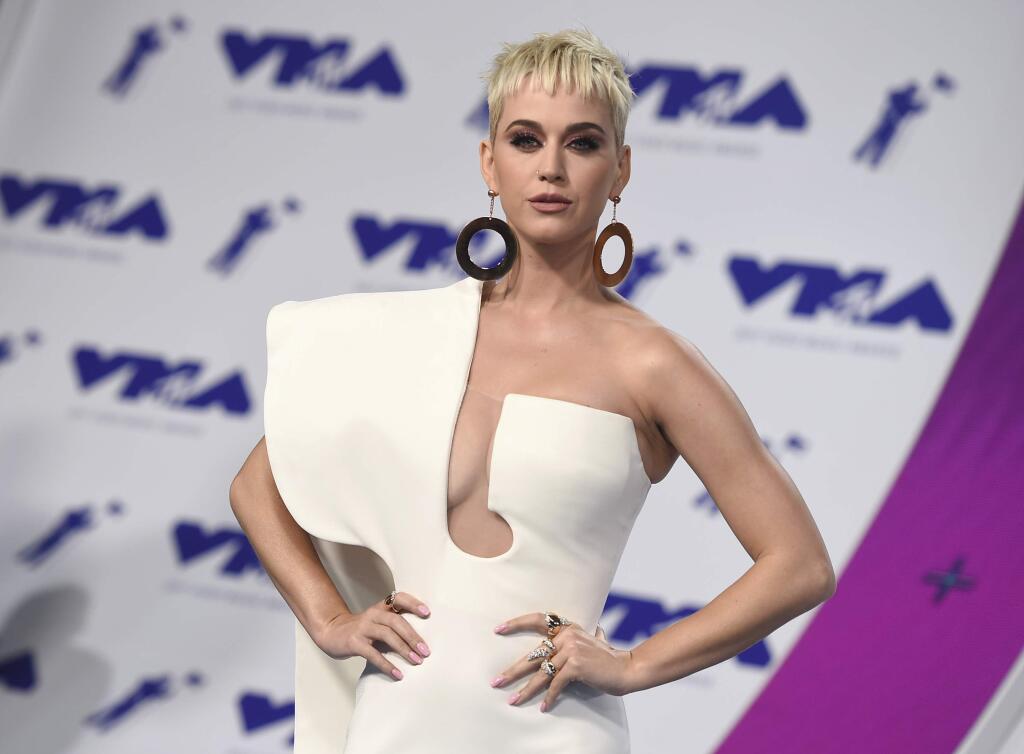 FILE - In this Aug. 27, 2017 file photo, Katy Perry arrives at the MTV Video Music Awards at The Forum in Inglewood, Calif. Perry drew criticism for kissing a contestant while a judge on ABC's 'American Idol.' (Photo by Jordan Strauss/Invision/AP, File)