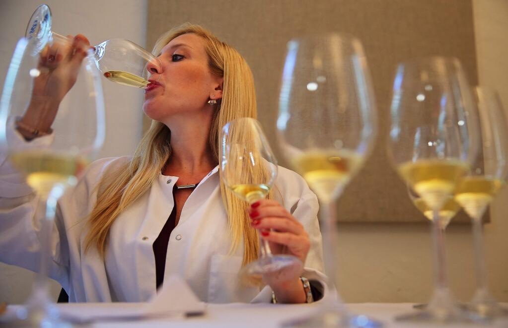 Jessica Altieri tastes chardonnay wines while judging the competition for the Harvest Fair, at the Sonoma County Fairgrounds, in Santa Rosa, on Tuesday, September 13, 2016. (Christopher Chung/ The Press Democrat)