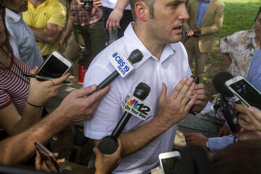 White nationalist Richard Spencer gives remarks after a white nationalist rally was declared an unlawful assembly on Saturday Aug. 12, 2017, in Charlottesville, Va. The group had gathered to protest plans by the city of Charlottesville to remove a statue of Confederate Gen. Robert E. Lee. (Shaban Athuman /Richmond Times-Dispatch via AP)
