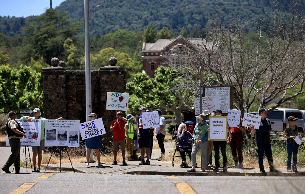 A group of about 75 people protest in front of the Sonoma Developmental Center in Glen Ellen, Monday, June 6, 2022. (Kent Porter / The Press Democrat) 2022