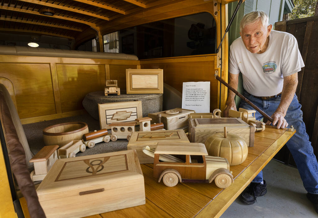 Retired woodshop teacher Frank Wheeler, 85, builds wooden vehicles, jewelry boxes, bowls and his 1939 Ford woody station wagon. Wheeler asks for $100 for his smaller pieces and has donated $30,000 to the Redwood Empire Food Bank in two years.    (John Burgess/The Press Democrat)