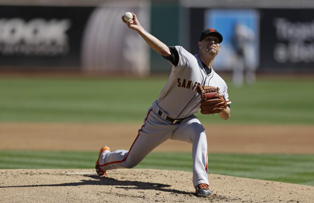 San Francisco Giants pitcher Tim Hudson works against the Oakland Athletics in the first inning Saturday, Sept. 26, 2015, in Oakland. (AP Photo/Ben Margot)