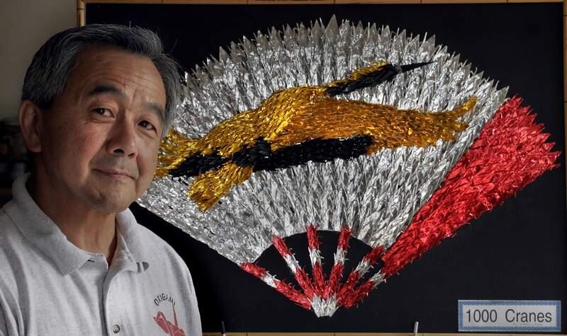Henry Kaku, master origami artist teaches in his Petaluma hometown and at national origami conferences. Among his works displayed when he travels: '1000 Cranes,' created from folding a thousand paper cranes and then assembling them as a fan with a crane. (Press Democrat/ Mark Aronoff)