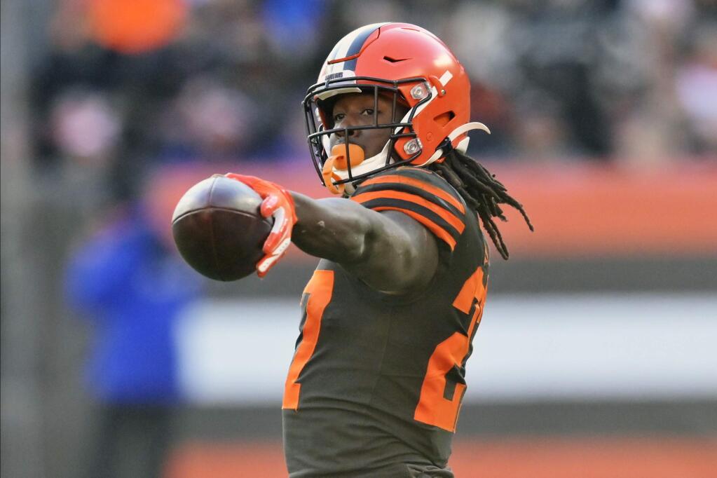 FILE - In this Dec. 22, 2019, file photo, Cleveland Browns running back Kareem Hunt reacts during an NFL football game against the Baltimore Ravens in Cleveland. The Browns opened a unique free agency period by placing a second-round tender on running back Kareem Hunt, who played eight games last season after returning from an NFL suspension. (AP Photo/David Richard, File)