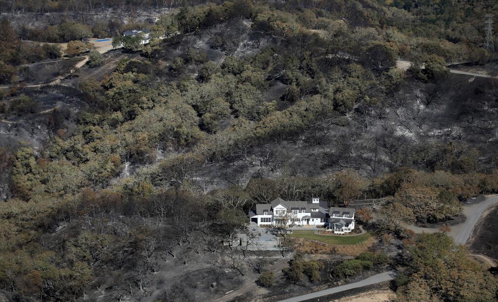 The Kincade fire burned around this home in the hills above Windsor, due in part to defensible space and the work of firefighters. Photo taken Monday, Nov. 4, 2019. (Kent Porter / The Press Democrat)