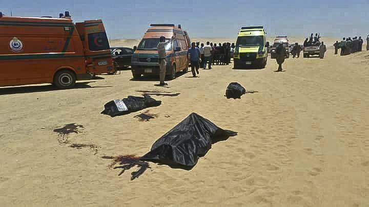 This image released by the Minya governorate media office shows bodies of victims killed when gunmen stormed a bus in Minya, Egypt, Friday, May 26, 2017. Egyptian officials say dozens of people were killed and wounded in an attack by masked militants on a bus carrying Coptic Christians, including children, south of Cairo. (Minya Governorate Media office via AP)
