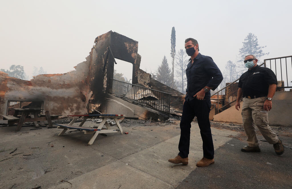 Gov. Gavin Newsom arrives at Foothills Adventist Elementary School while touring areas damaged by the Glass fire near St. Helena on Thursday, Oct. 1, 2020. (Christopher Chung / The Press Democrat)